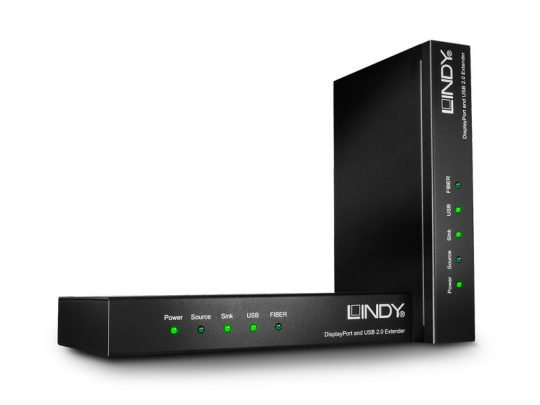 Two black Lindy KVM Extender devices, including the new Lindy 39380 model, stand upright side by side on a white background. Each device features green LED indicator lights labeled power, source, sink, USB, and fiber for status monitoring.
