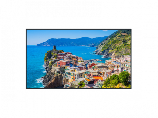 Colorful seaside village print featuring vibrant houses perched on rocky cliffs above a bright blue sea, with lush green hills and a clear sky in the background—perfect wall art for coastal home décor.
