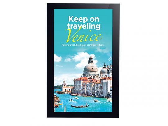 Digital signage screen displaying a vibrant image of Venice, Italy with blue skies, historic buildings, and gondolas on the canal. The advertisement reads: Keep on traveling Venice. Make your holiday dreams come true with us. Ideal for travel marketing and digital advertising displays.