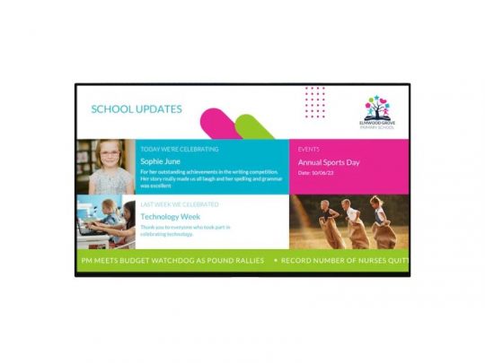 Digital school update board showing student achievements, upcoming Annual Sports Day on October 26, 2023, and recent events such as Technology Week; features student photos and a scrolling news ticker at the bottom.