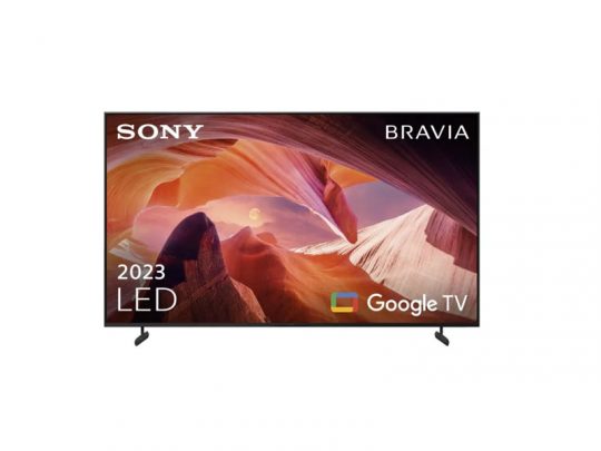 Sony Bravia LED TV displaying a vibrant landscape on the screen, with 2023 LED and Google TV text shown. The television has slim bezels, stands on two legs, and is set against a plain white background.